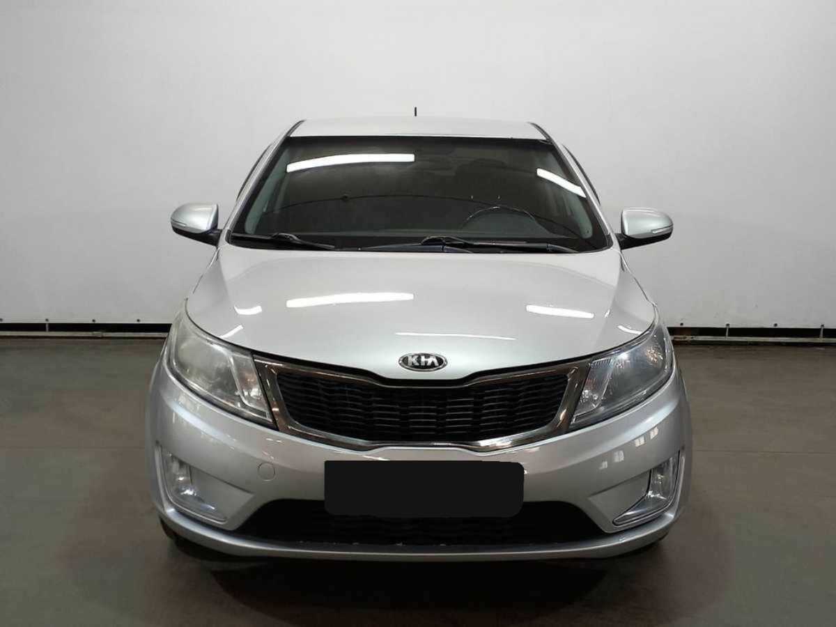 Kia Rio с пробегом — 2013 год. Фото: #1