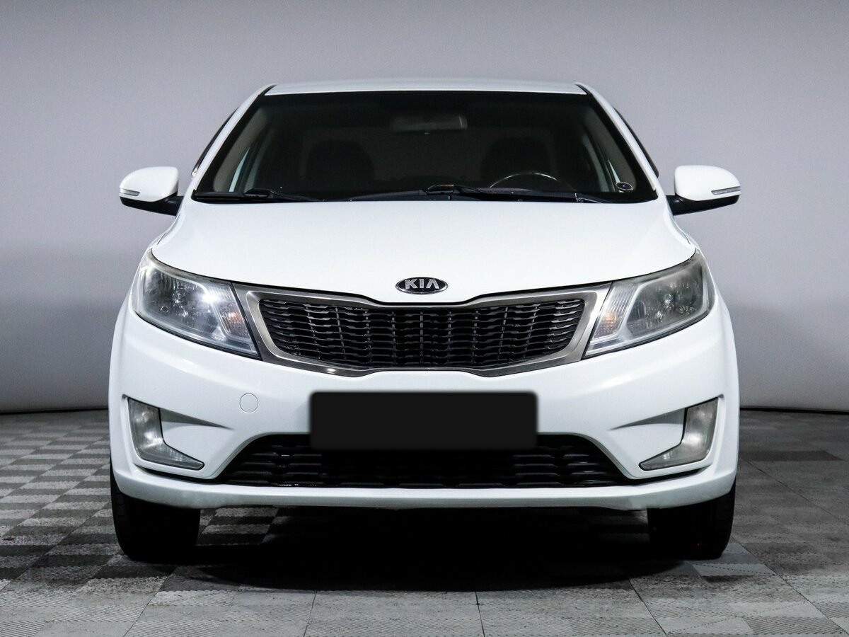 Kia Rio с пробегом — 2013 год. Фото: #1