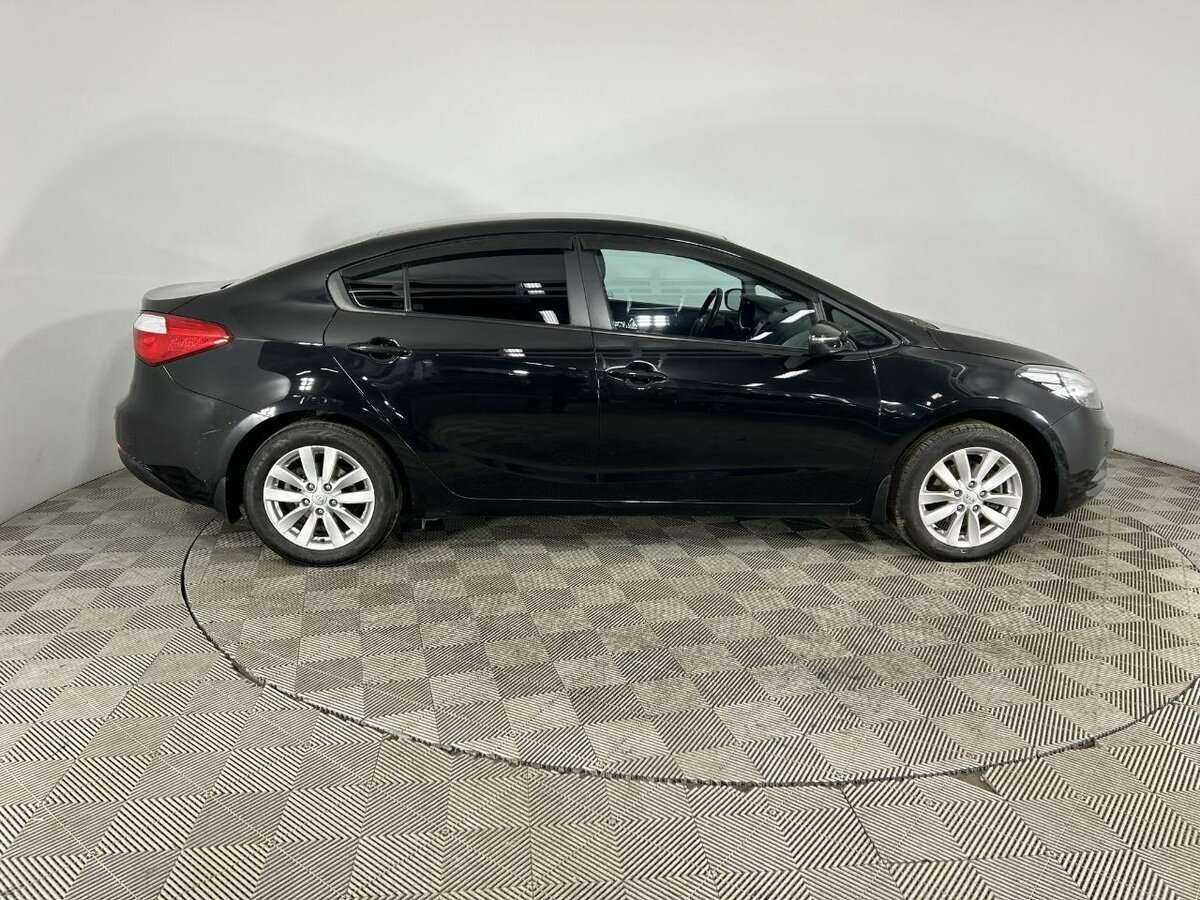 Kia Cerato с пробегом — 2014 год. Фото: #3
