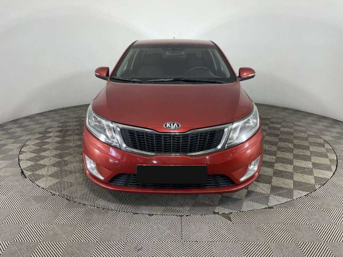 Kia Rio с пробегом — 2013 год. Фото: #1